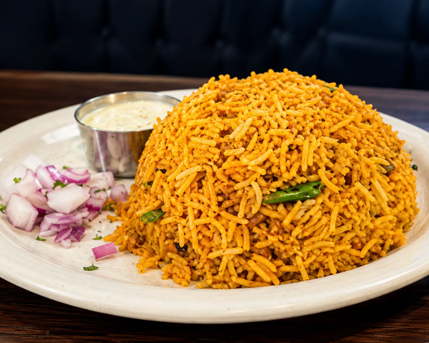 Chicken 65 Biryani with fragrant basmati rice and raita at Krishna's Dosa Grill Surrey